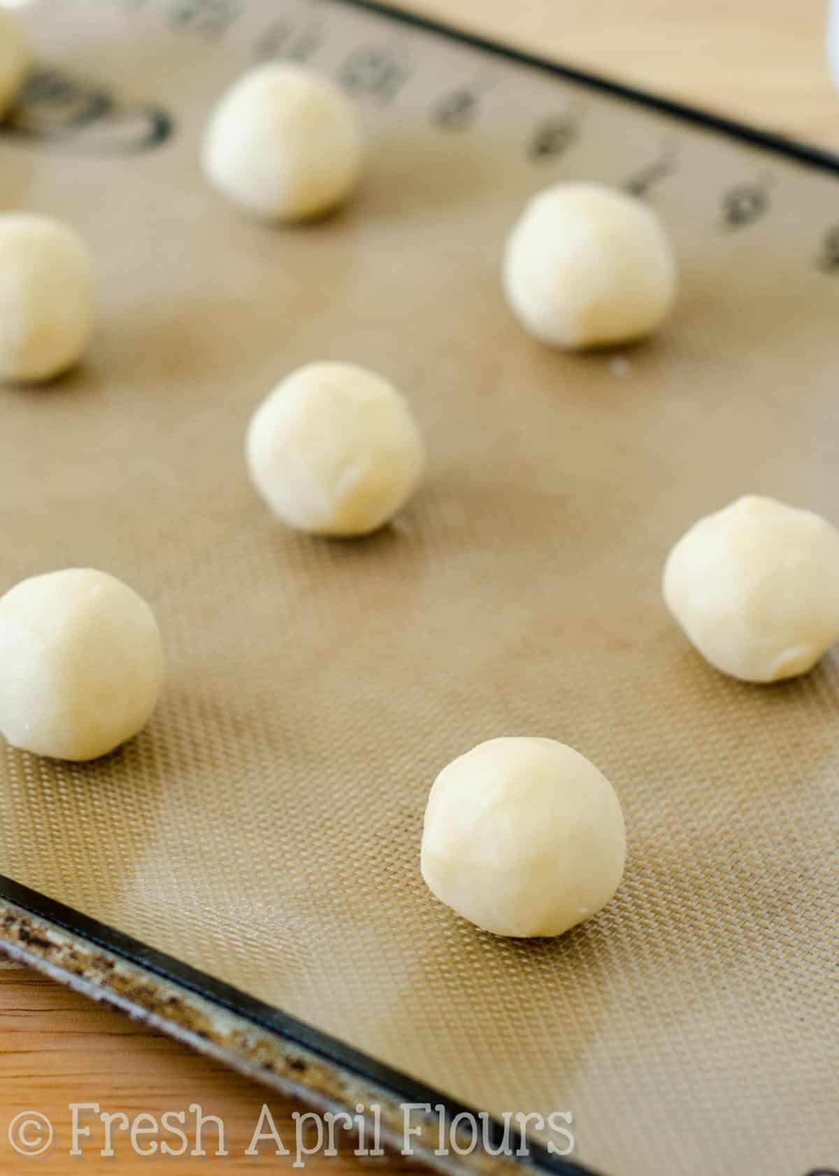 Thumbprint cookie dough on a plate.