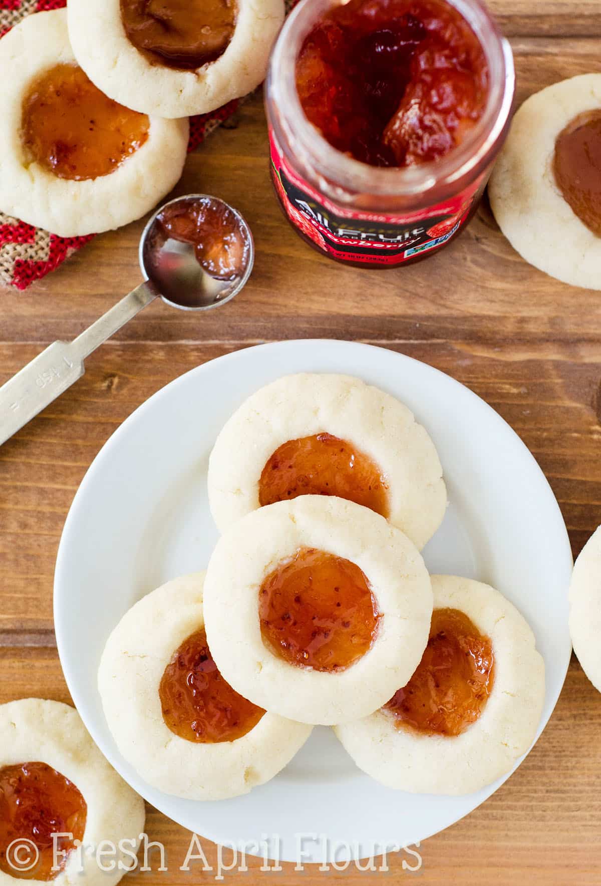 Aerial photo of thumbprint cookies on a plate.