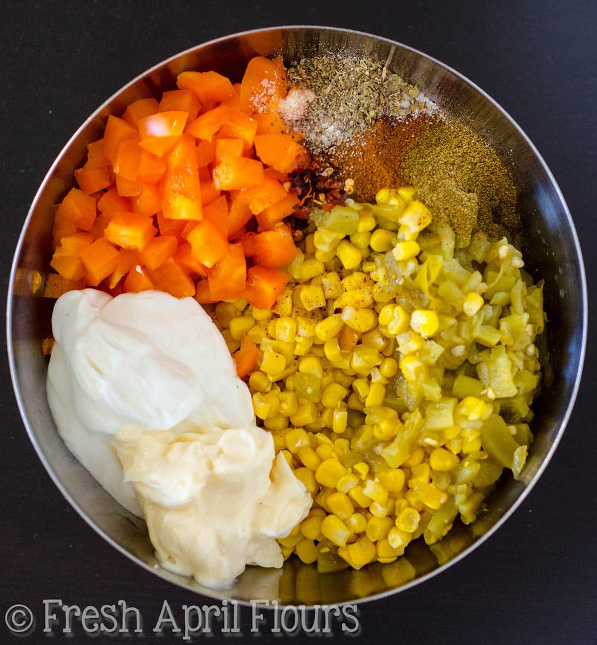 Ingredients for southwest corn dip in a large bowl.