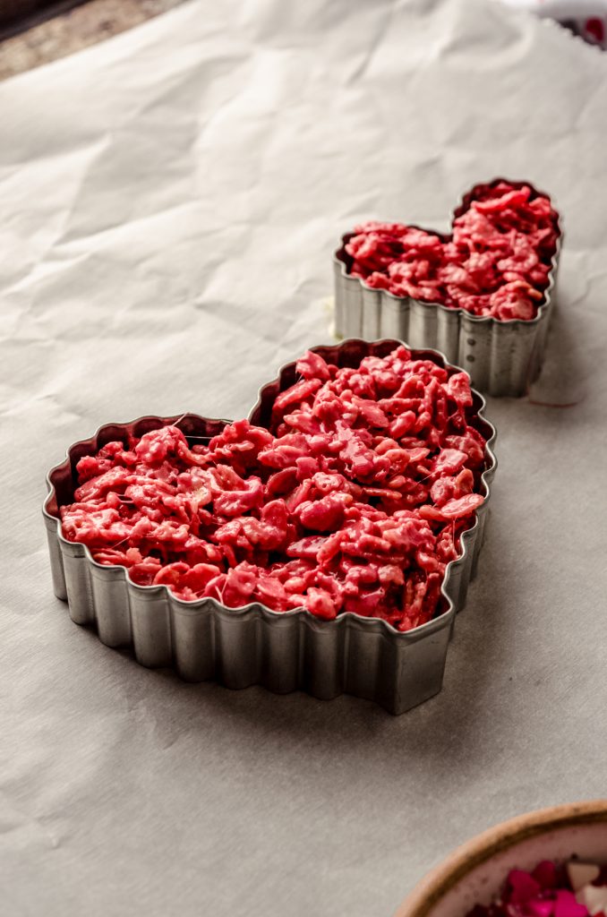 Red velvet Rice Krispie treats pressed into heart shaped cookie cutters. ma