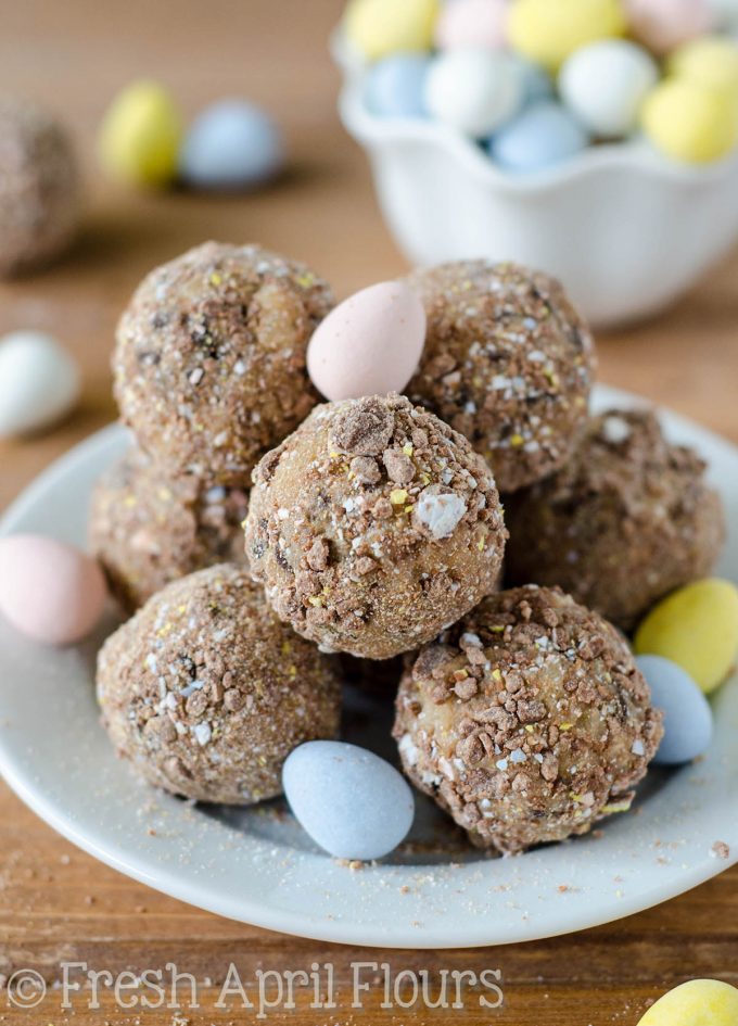 Cadbury Egg Cookie Dough Bites: Eggless and safe-to-eat chocolate chip cookie dough balls filled and coated with crunchy pieces of Cadbury Mini Eggs. The perfect treat for Easter!