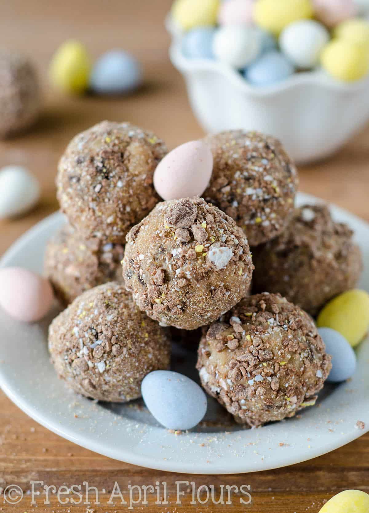 Chocolate Chip Mini Egg Cookie Dough Bites: Eggless and safe-to-eat chocolate chip cookie dough balls filled and coated with crunchy pieces of Cadbury Mini Eggs. The perfect treat for Easter!