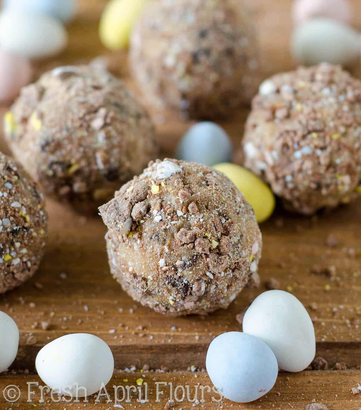 Chocolate Chip Mini Egg Cookie Dough Bites: Eggless and safe-to-eat chocolate chip cookie dough balls filled and coated with crunchy pieces of Cadbury Mini Eggs. The perfect treat for Easter!