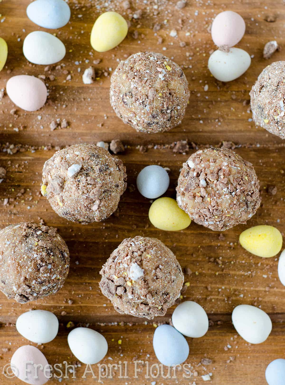Chocolate Chip Mini Egg Cookie Dough Bites: Eggless and safe-to-eat chocolate chip cookie dough balls filled and coated with crunchy pieces of Cadbury Mini Eggs. The perfect treat for Easter!