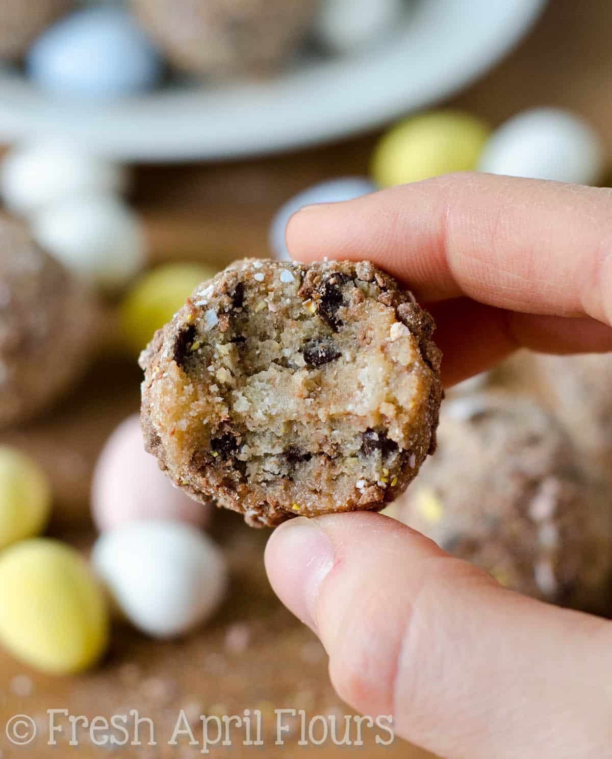Cadbury Egg Cookie Dough BitesL Eggless and safe-to-eat chocolate chip cookie dough balls filled and coated with crunchy pieces of Cadbury Mini Eggs. The perfect treat for Easter! via @frshaprilflours