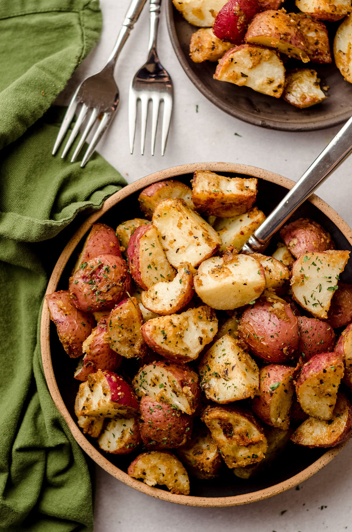 aerial photo of roasted herbed potatoes in a bowl