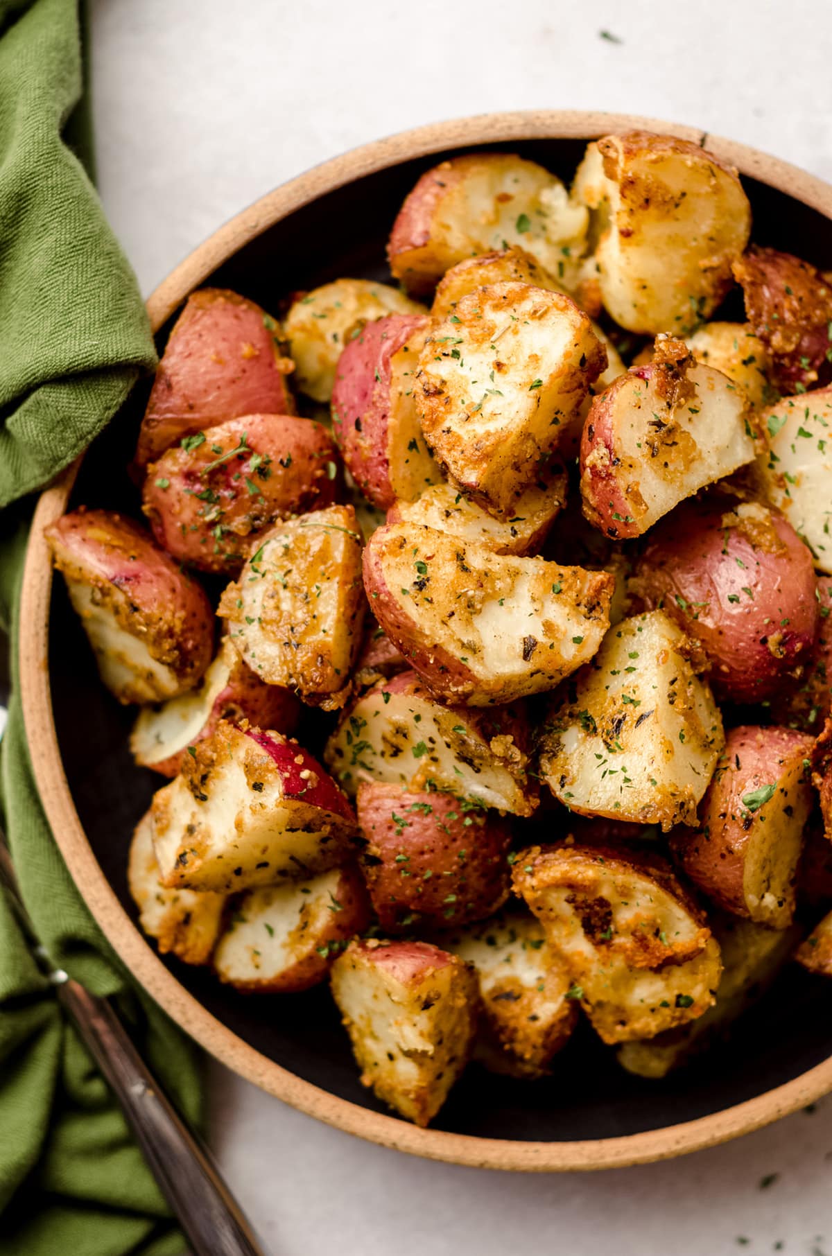 aerial photo of roasted herbed potatoes in a bowl