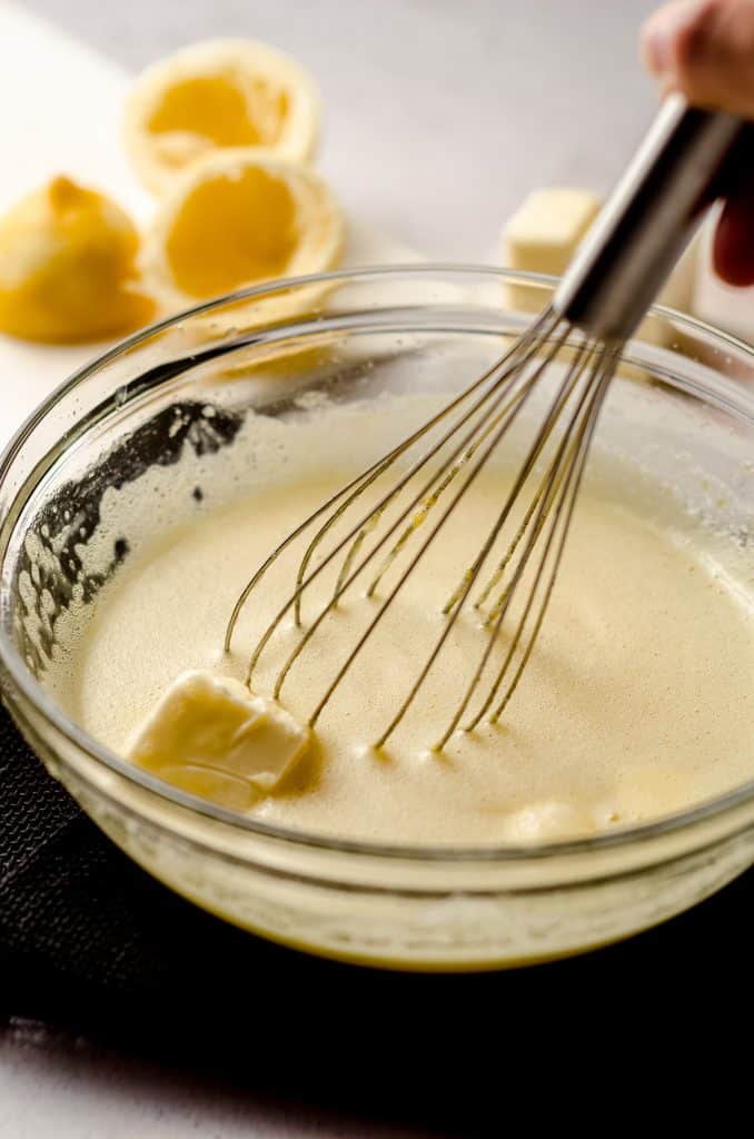 whisking butter into lemon curd