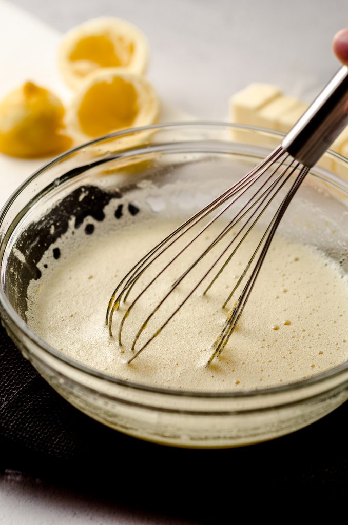 whisking butter into lemon curd