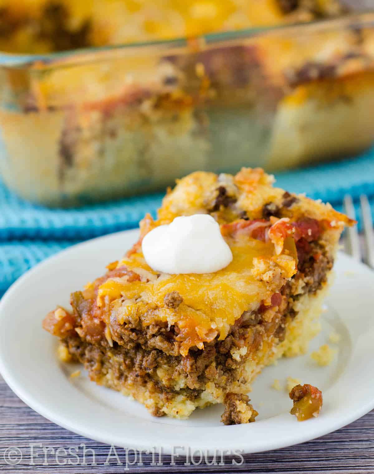 Baked Taco Casserole: An easy casserole layered with quick cornbread, seasoned meat, salsa, and cheese. Perfect for a quick weeknight meal and makes great leftovers!