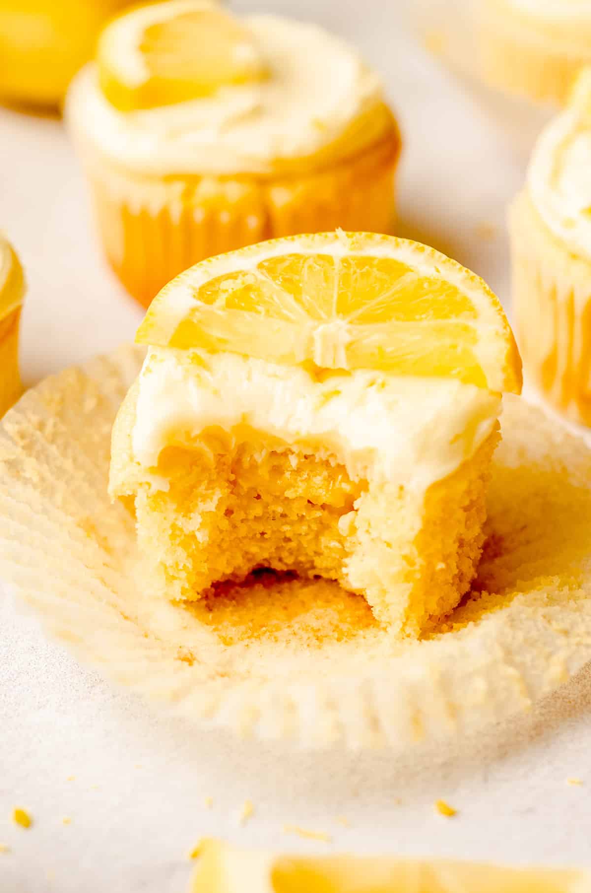 triple lemon cupcake with a bite taken out of it