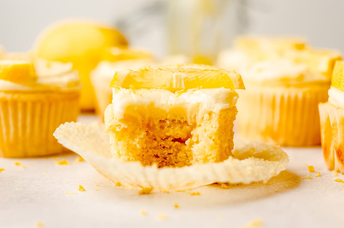 triple lemon cupcake with a bite taken out of it