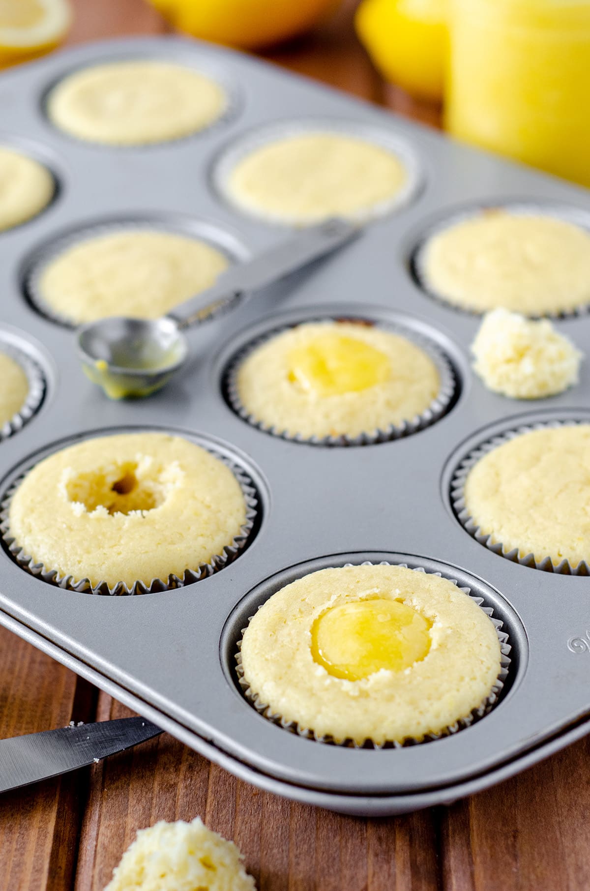 filling lemon cupcakes with lemon curd