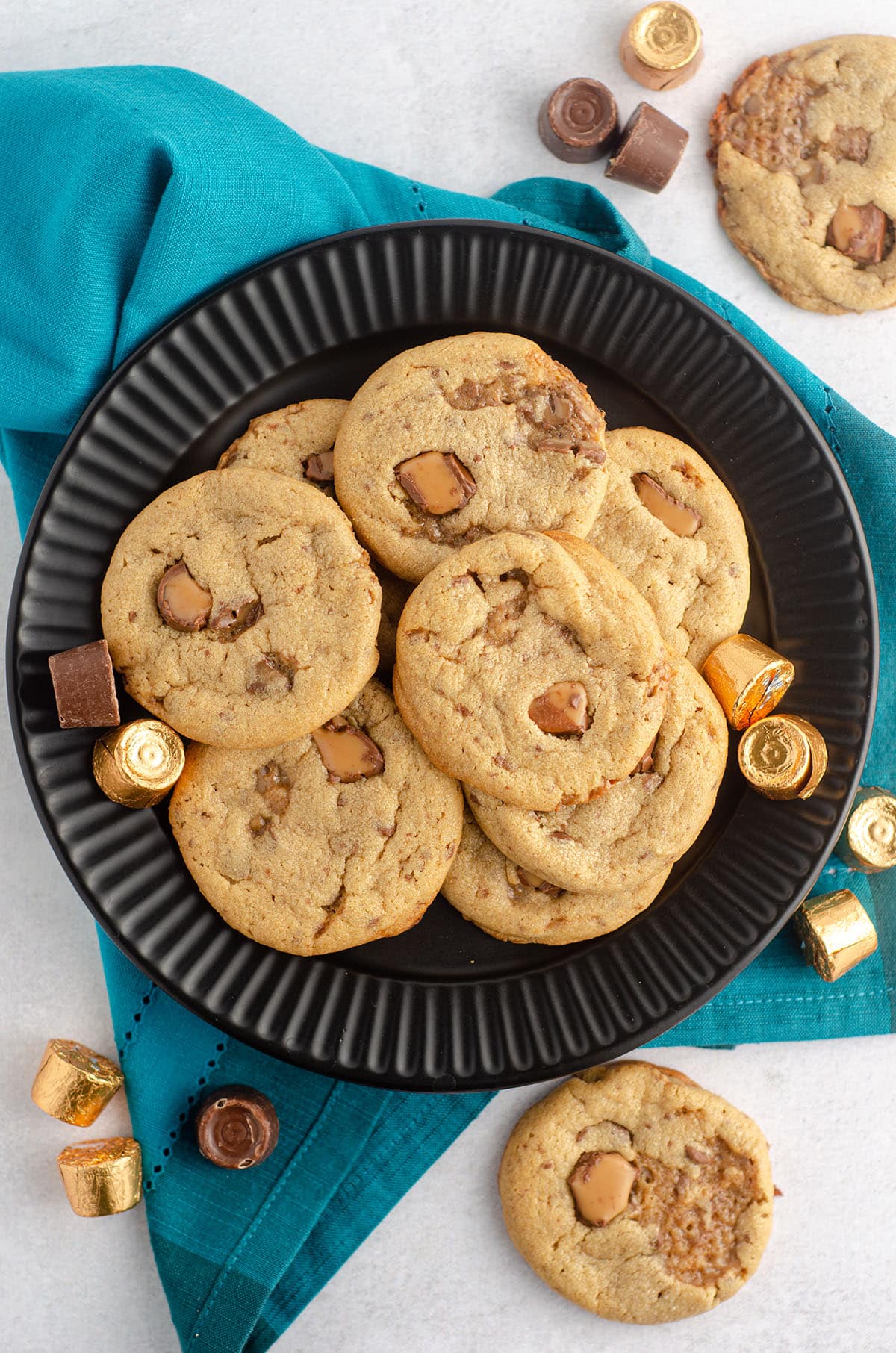 aerial photo of peanut butter rolo cookies on a black plate