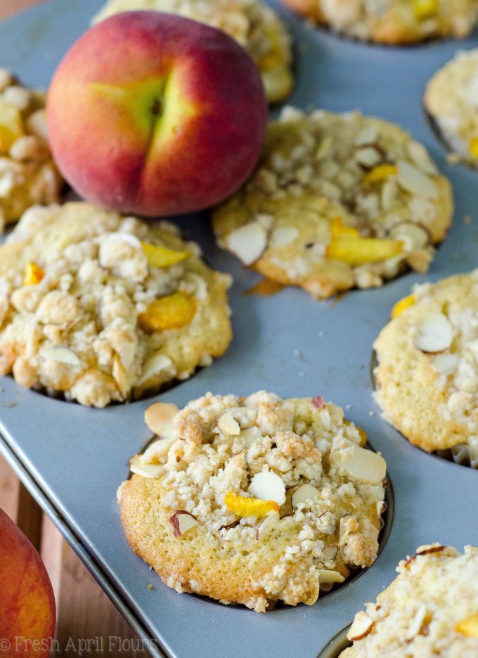 Peach Almond Streusel Muffins: Moist and tender peach muffins, accented with almond extract and topped with a sweet and crunchy almond streusel.