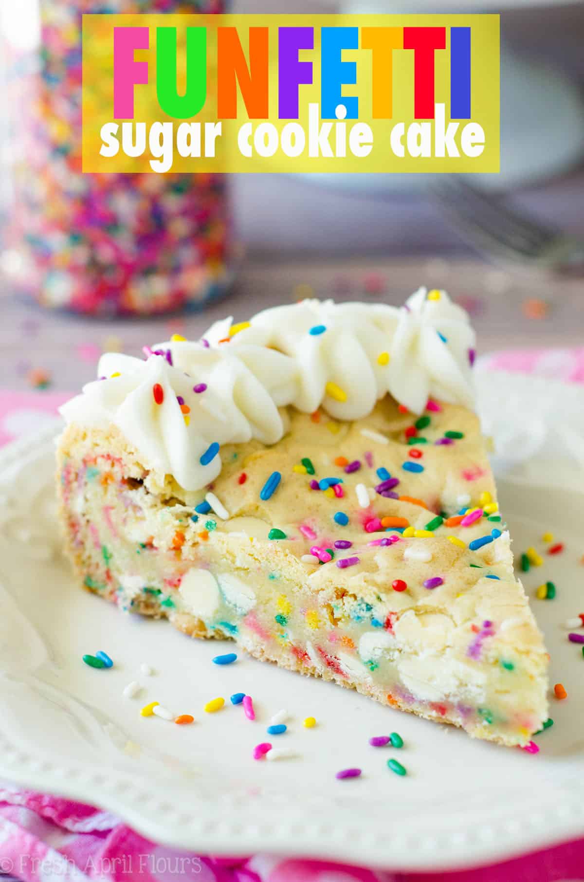Funfetti Sugar Cookie Cake: Soft and buttery in the center, crunchy around the edges, and filled with plenty of white chocolate chips and sprinkles to celebrate any occasion. Topped with a creamy and buttery almond vanilla buttercream.