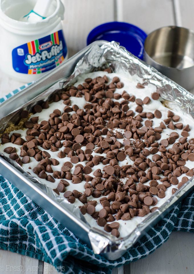 S'mores Chewy Cookie Bars: Soft and chewy graham cookie bars filled with a fluffy layer of marshmallow creme and milk chocolate chips. All the s'more without the flame!