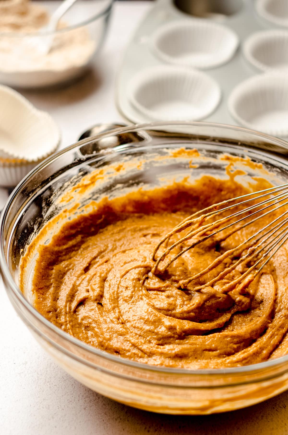 pumpkin streusel muffin batter in a bowl