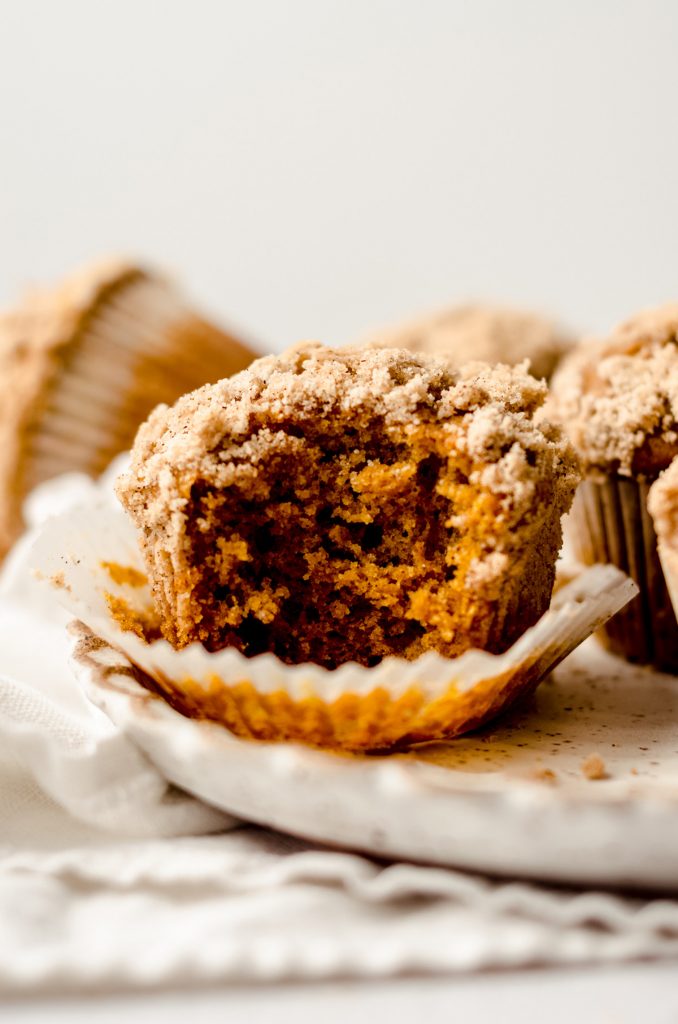 pumpkin streusel muffin with a bite taken out of it