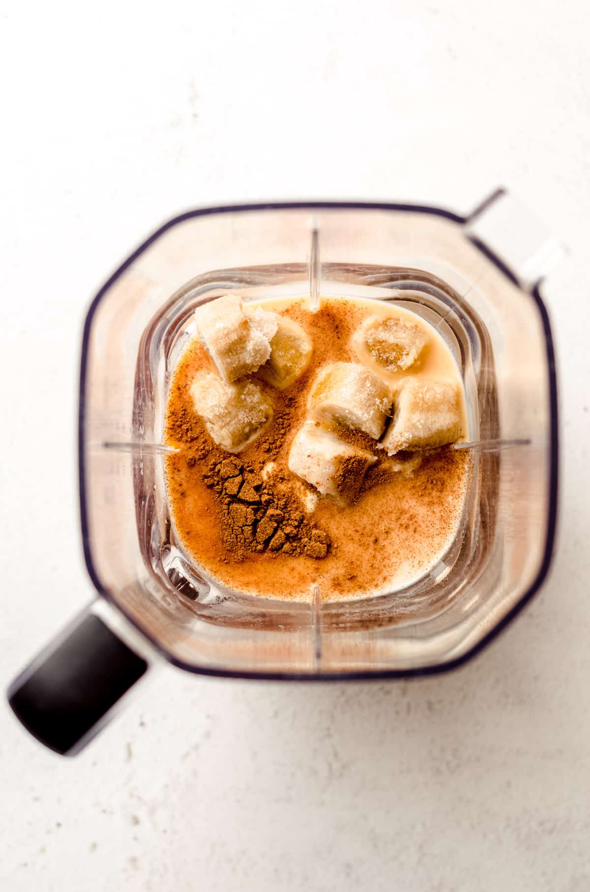 ingredients for pumpkin pie smoothie in a blender