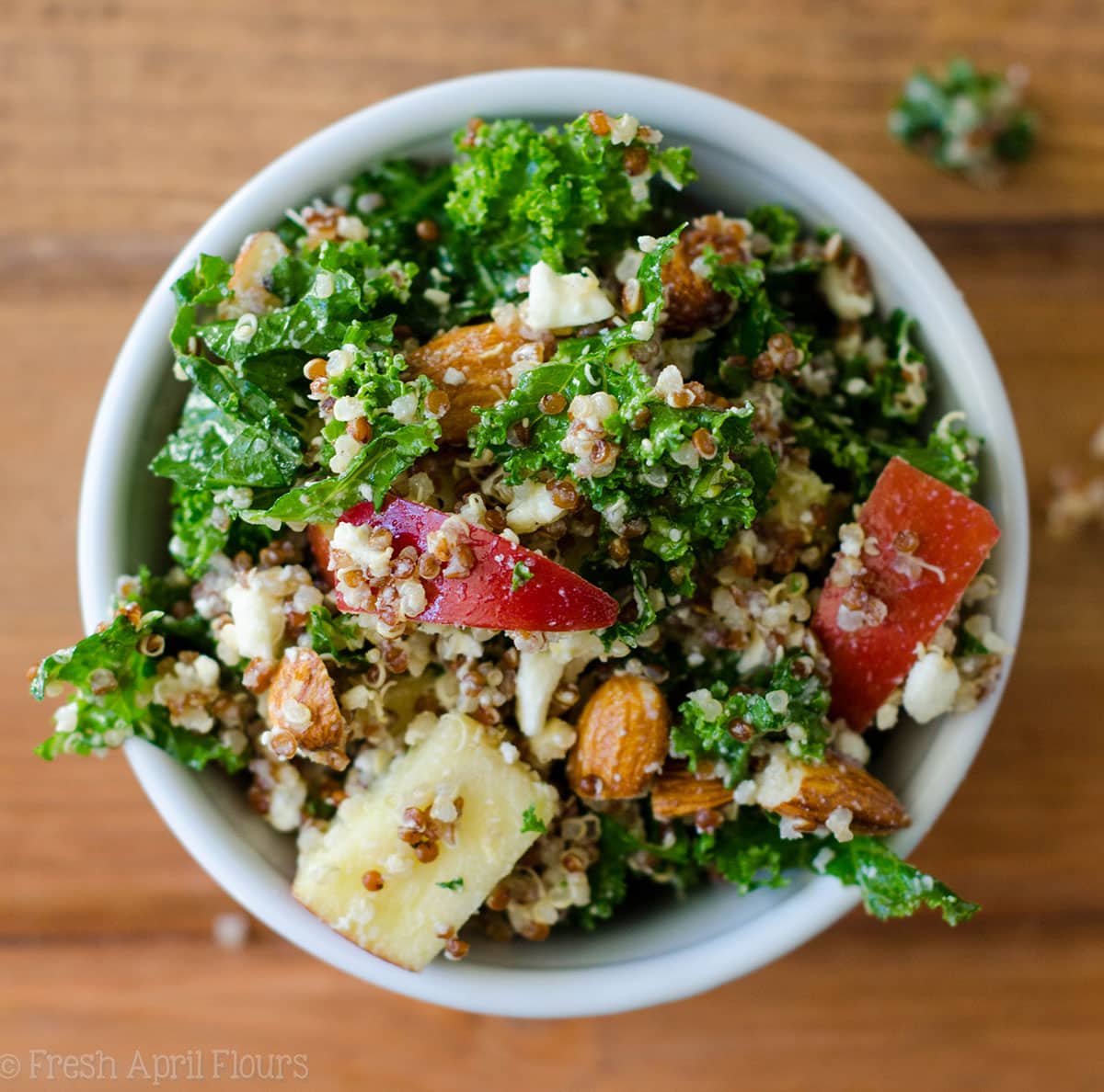 Apple, Quinoa, and Almond Kale Salad: An easy, no bake side dish packed with flavor, fiber, and protein.