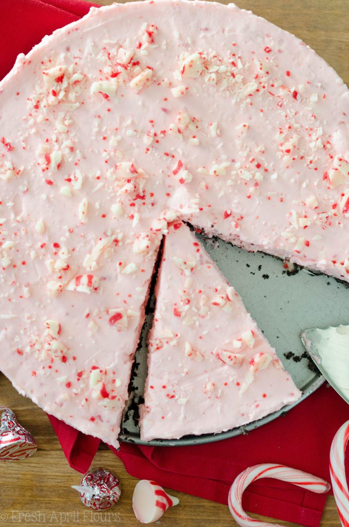 No Bake Candy Cane Crunch Pie: Creamy, minty pie studded with chopped Candy Cane Kisses all on top of a crunchy Oreo cookie crust.