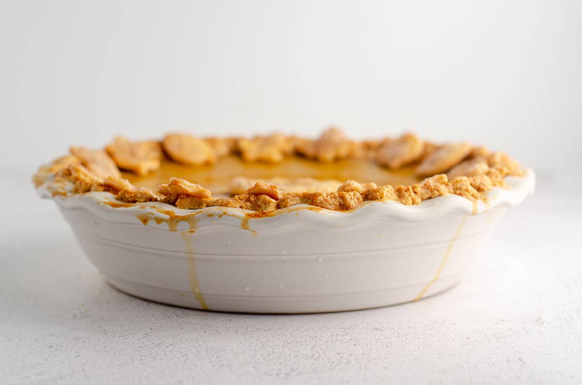 pumpkin pie in a white pie dish