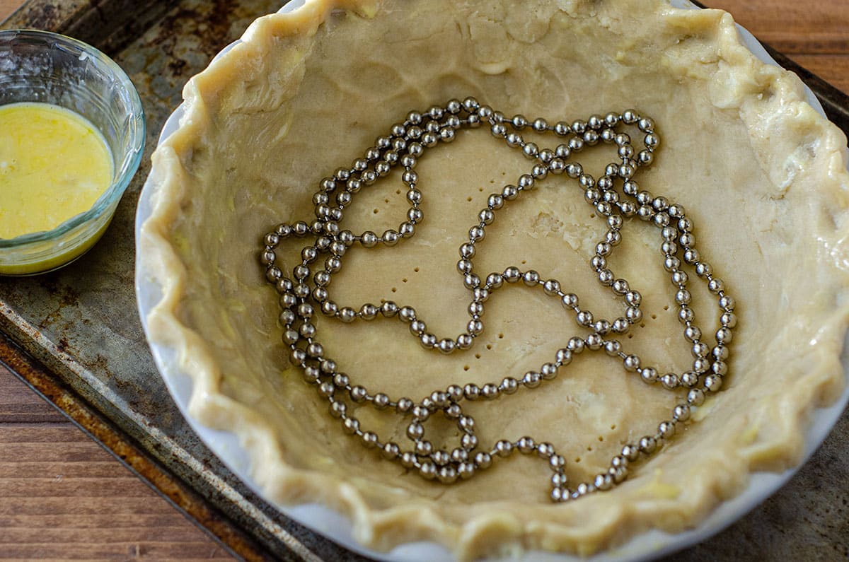 pie chain in a pie crust before blind baking