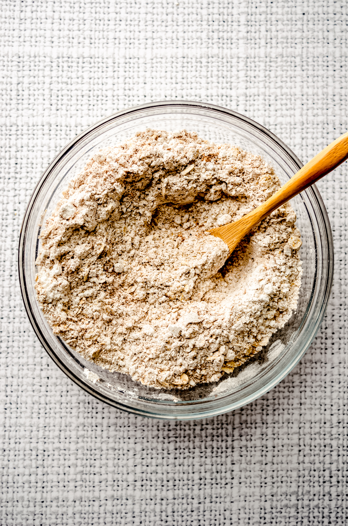 Aerial photo of ingredients in a bowl to make molasses iced oatmeal cookies.