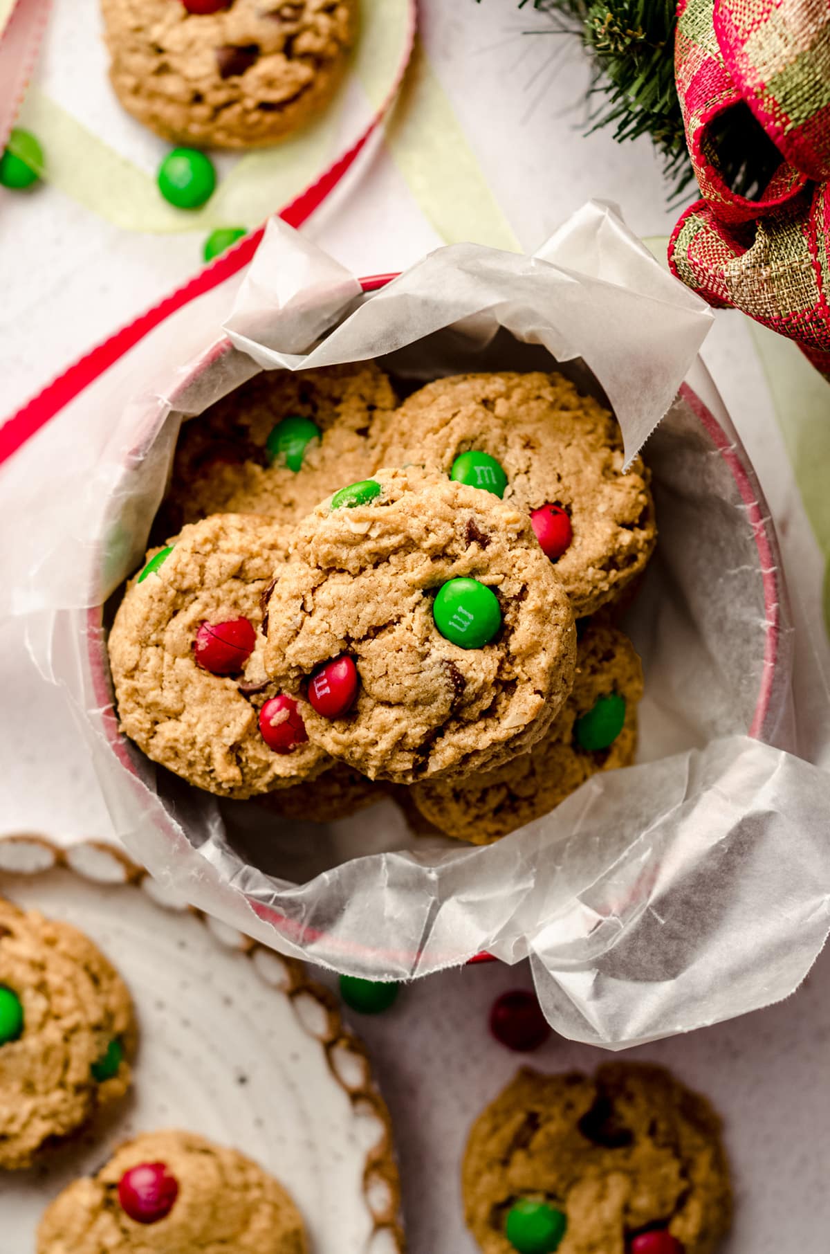 christmas monster cookies in a cookie tin