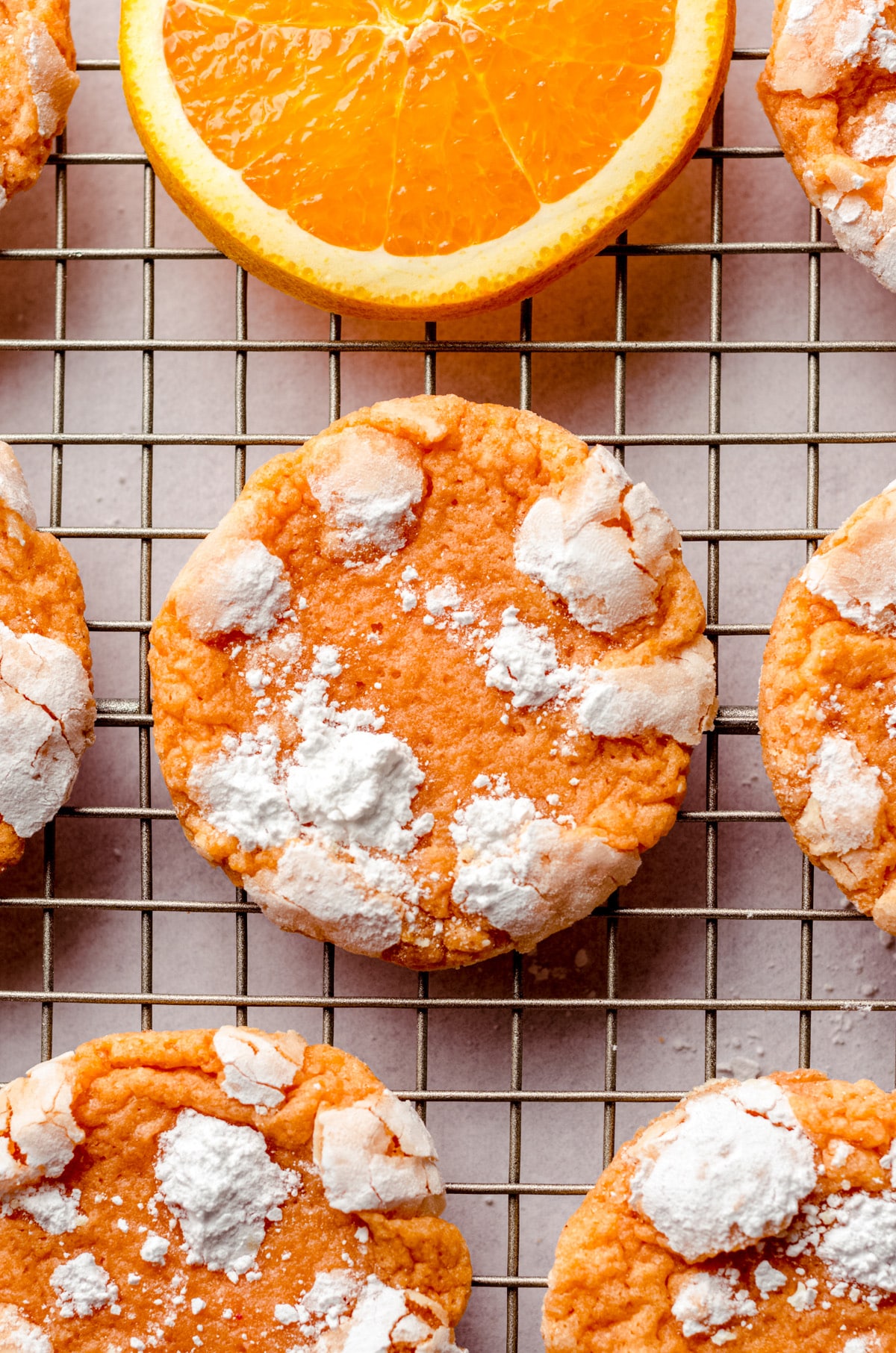 aerial photo of orange creamsicle cookies on a wire cooling rack