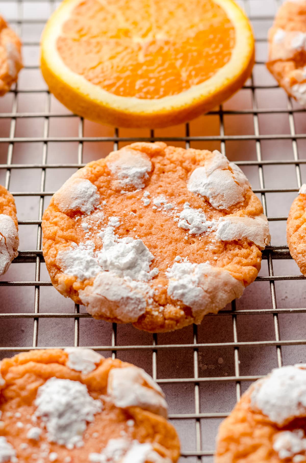 orange creamsicle cookies on a wire cooling rack