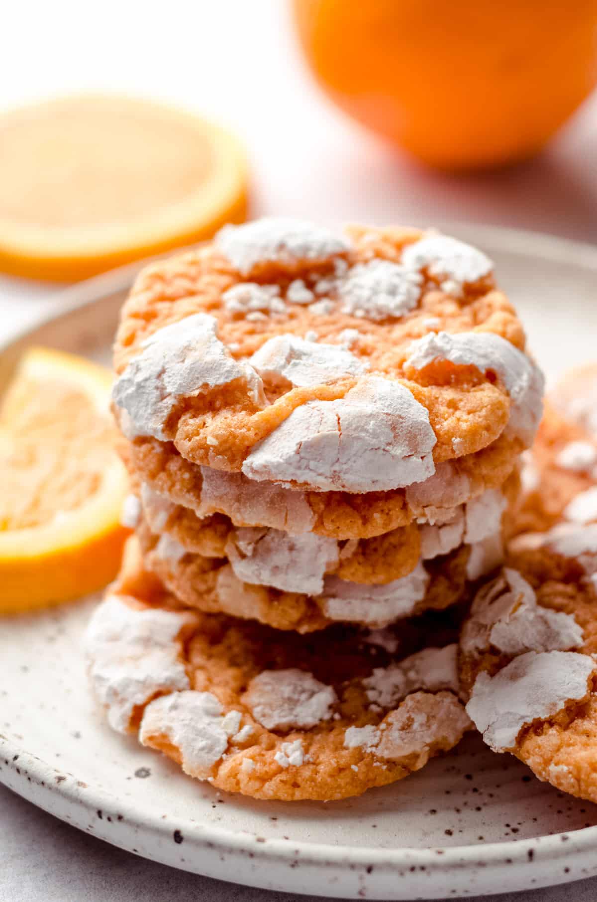 stack of orange creamsicle cookies on a plate