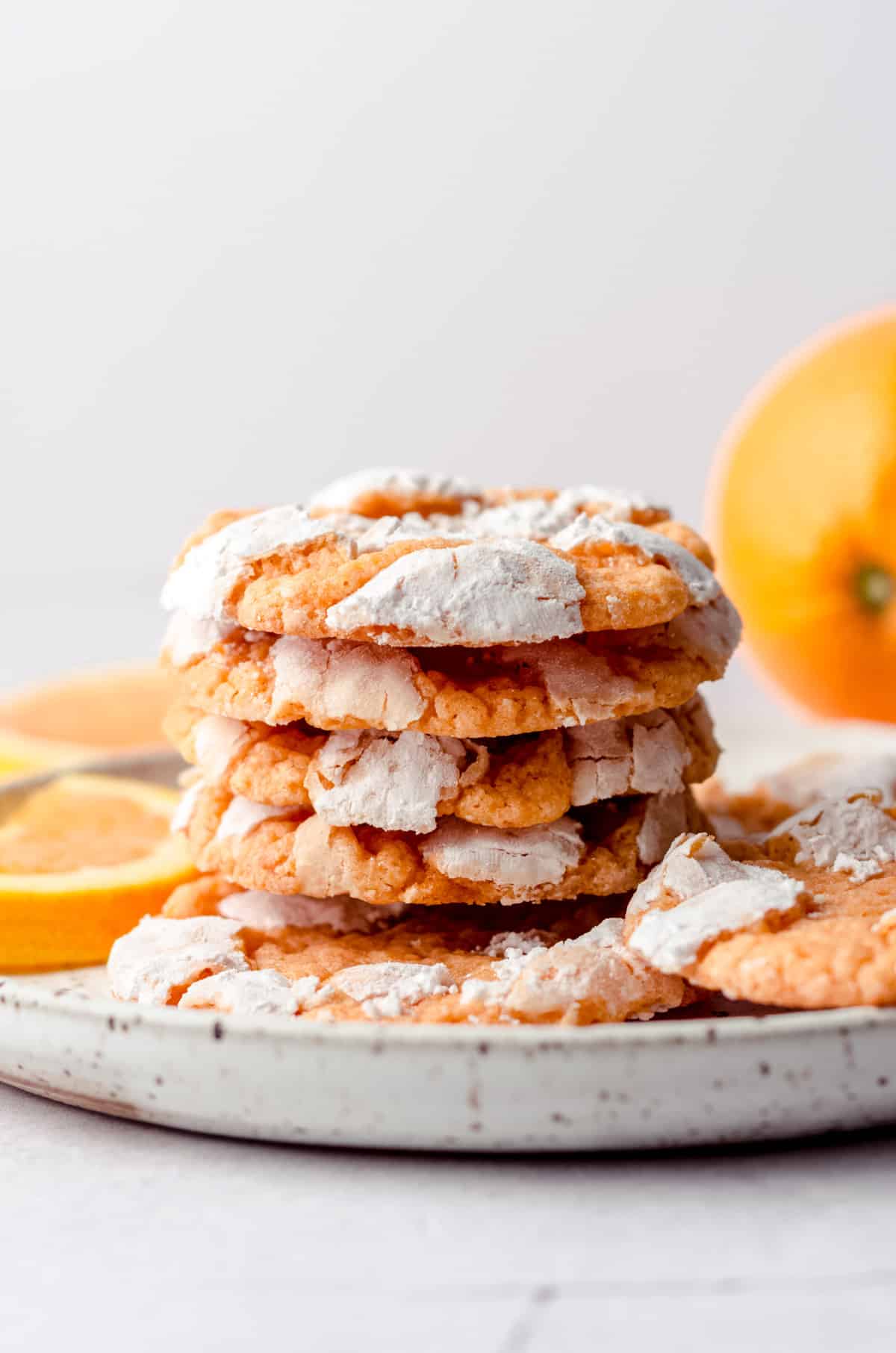 stack of orange creamsicle cookies on a plate