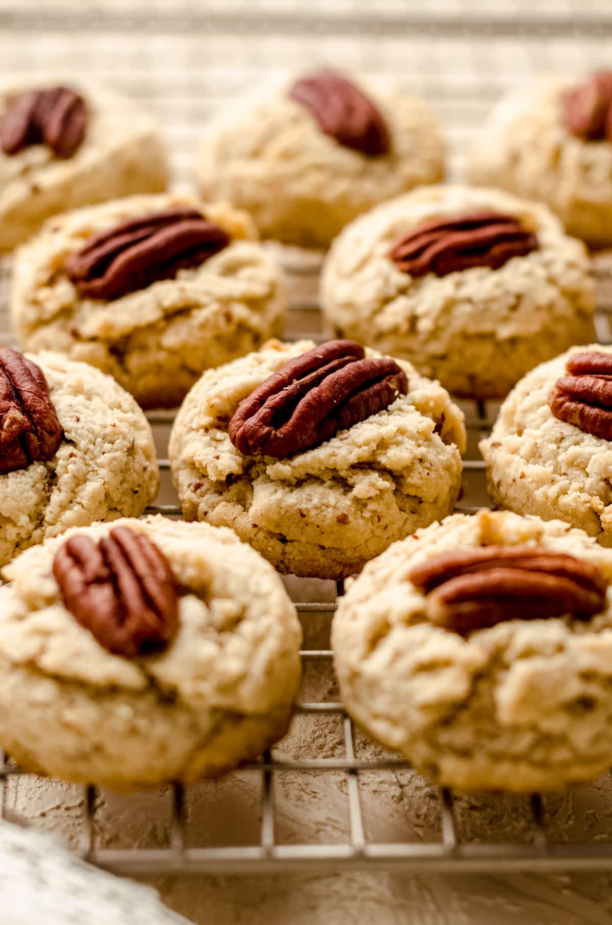 almond flour pecan sandies on a cooling rack