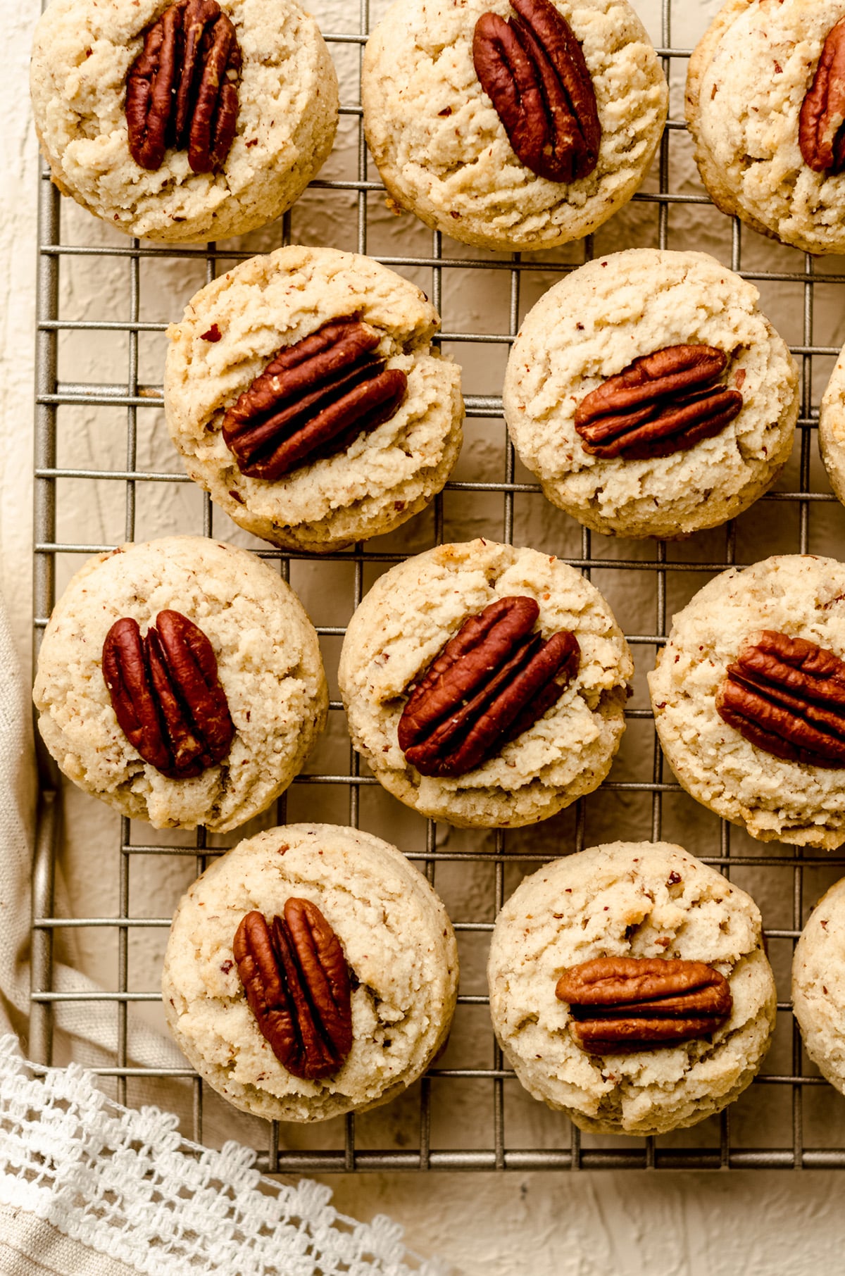 aerial photo of gluten free pecan sandies on a cooling rack