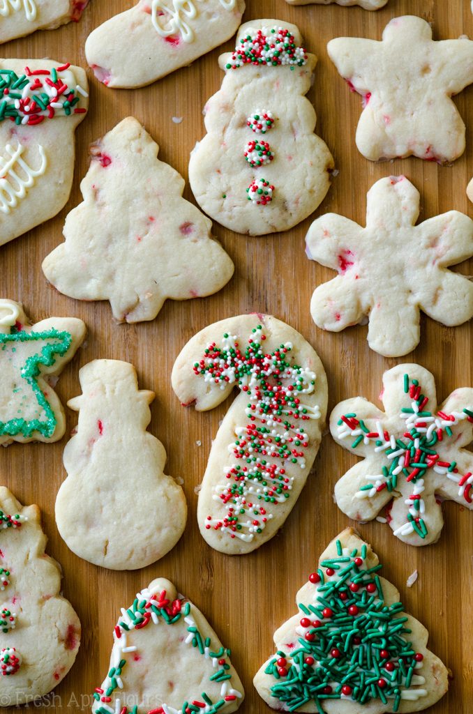 Peppermint Cut-Out Sugar Cookies: No dough chilling necessary for these soft cut-out sugar cookies that are perfect for decorating with chocolate, icing, or sprinkles. Crisp edges, soft centers, and filled with bits of candy canes!