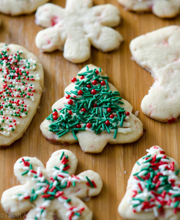 Peppermint Cut-Out Sugar Cookies: No dough chilling necessary for these soft cut-out sugar cookies that are perfect for decorating with chocolate, icing, or sprinkles. Crisp edges, soft centers, and filled with bits of candy canes!