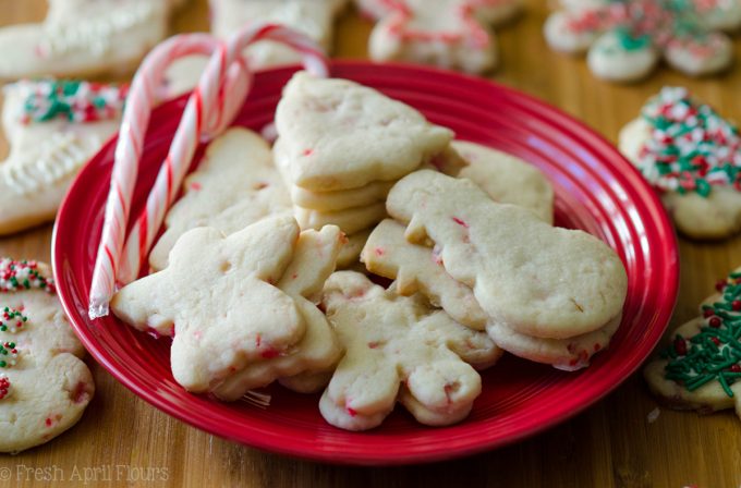 Peppermint Cut-Out Sugar Cookies: No dough chilling necessary for these soft cut-out sugar cookies that are perfect for decorating with chocolate, icing, or sprinkles. Crisp edges, soft centers, and filled with bits of candy canes!