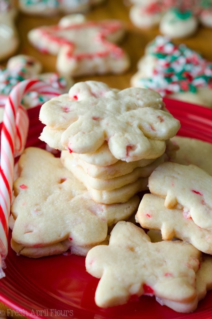 Peppermint Cut-Out Sugar Cookies: No dough chilling necessary for these soft cut-out sugar cookies that are perfect for decorating with chocolate, icing, or sprinkles. Crisp edges, soft centers, and filled with bits of candy canes!