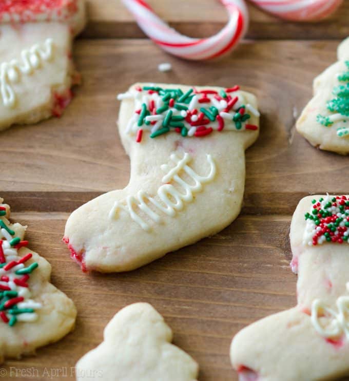 Peppermint Cut-Out Sugar Cookies: No dough chilling necessary for these soft cut-out sugar cookies that are perfect for decorating with chocolate, icing, or sprinkles. Crisp edges, soft centers, and filled with bits of candy canes!