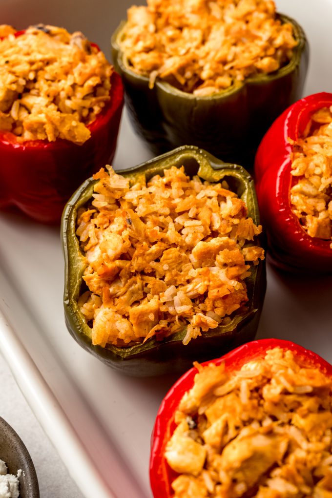 Buffalo chicken stuffed peppers in a casserole dish.