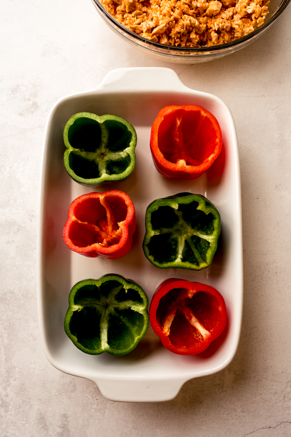 Aerial photo of a casserole dish with bell peppers in it.