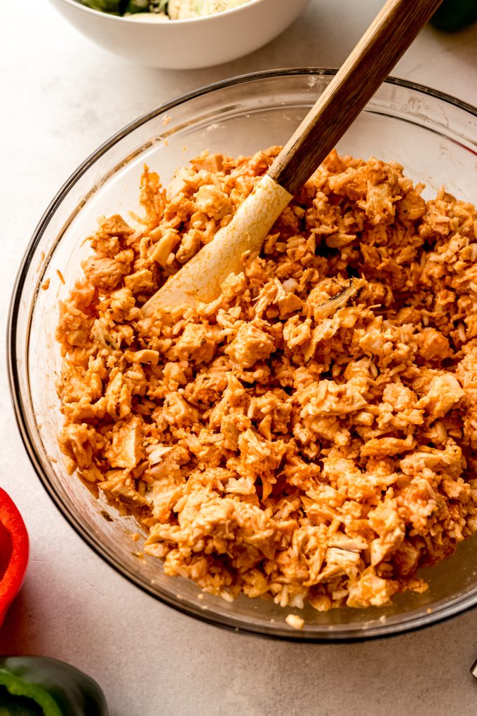 A bowl of the filling for buffalo chicken stuffed peppers.