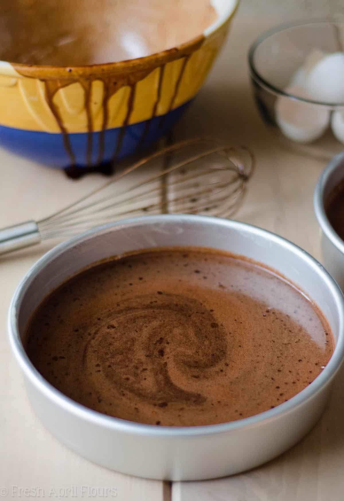 dark chocolate cake batter in a baking pan