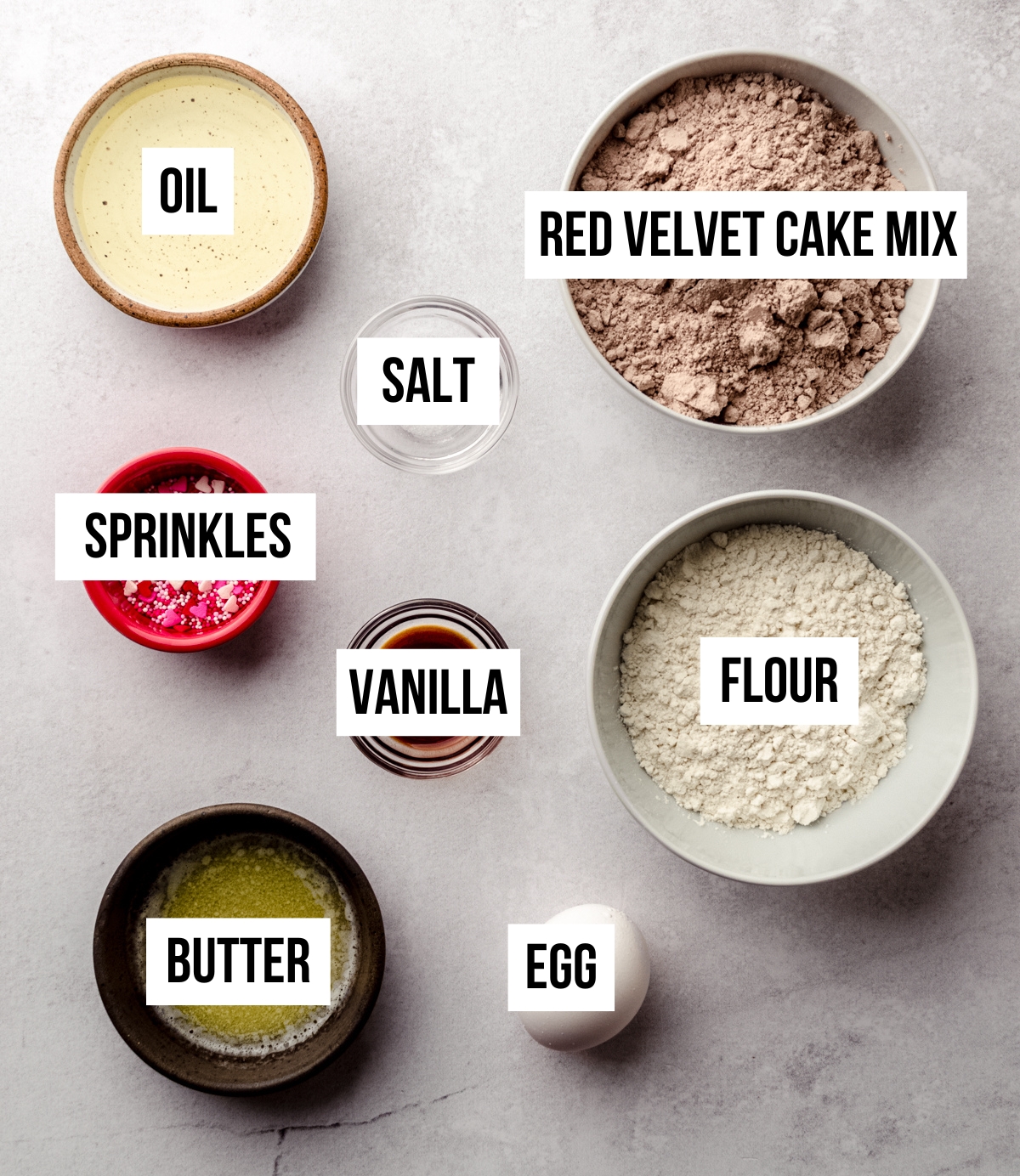 Aerial photo for ingredients for red velvet biscotti with text overlay.