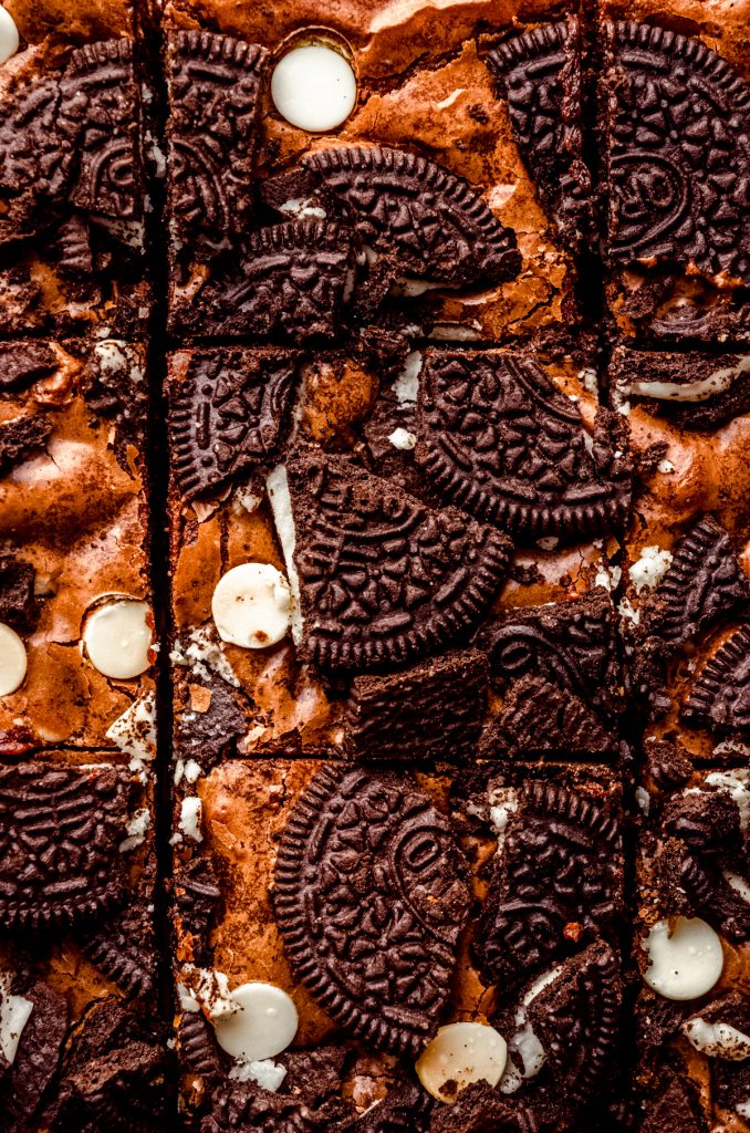 Closeup aerial photo of cookies and cream brownies that have been sliced.