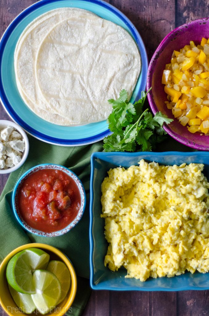 Vegetarian Breakfast Tacos: Mix and match your favorite toppings with the base of creamy goat cheese scrambled eggs and seasoned peppers and onions. Perfect for a breakfast buffet to please a crowd.