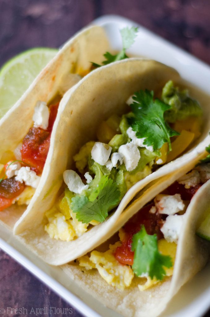 Vegetarian Breakfast Tacos: Mix and match your favorite toppings with the base of creamy goat cheese scrambled eggs and seasoned peppers and onions. Perfect for a breakfast buffet to please a crowd.