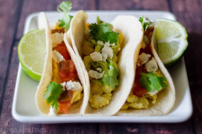 Vegetarian Breakfast Tacos: Mix and match your favorite toppings with the base of creamy goat cheese scrambled eggs and seasoned peppers and onions. Perfect for a breakfast buffet to please a crowd.